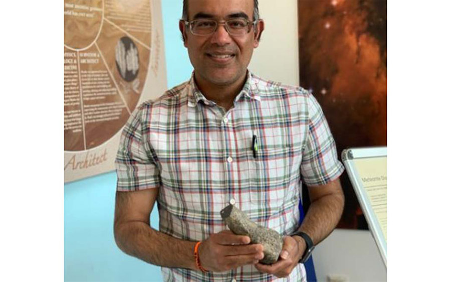 Dr Anand, with the largest piece of Moon rock in the UK